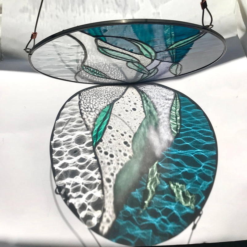 Stained glass panel with butterfly design on a white background