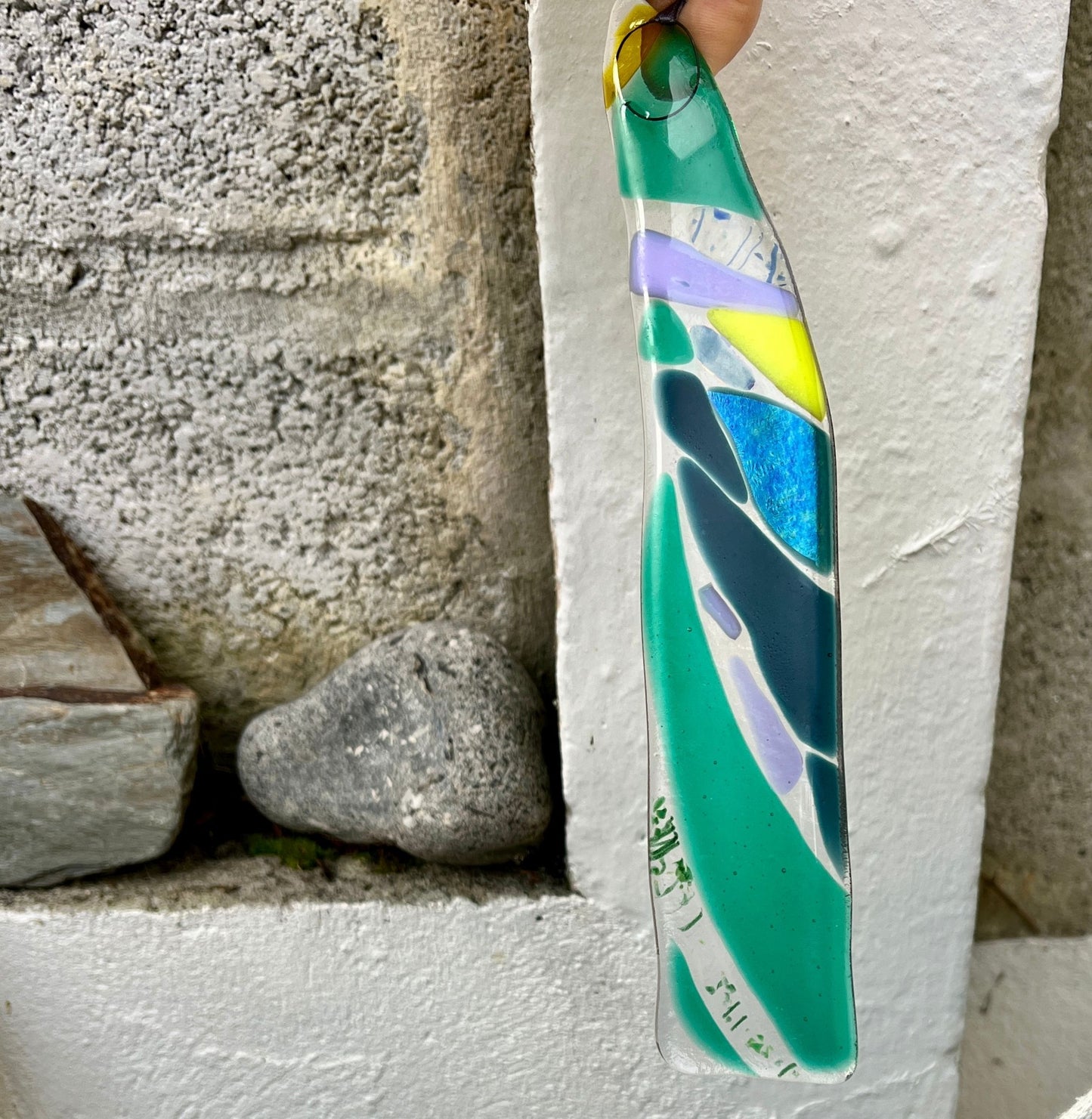 Kilned glass pendant made in greens and blues