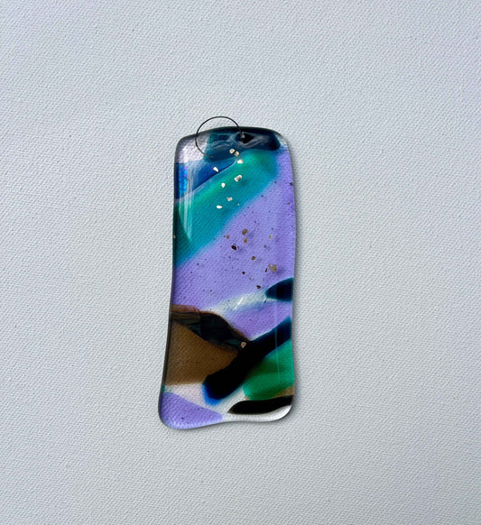 Colorful abstract pendant on a light gray background