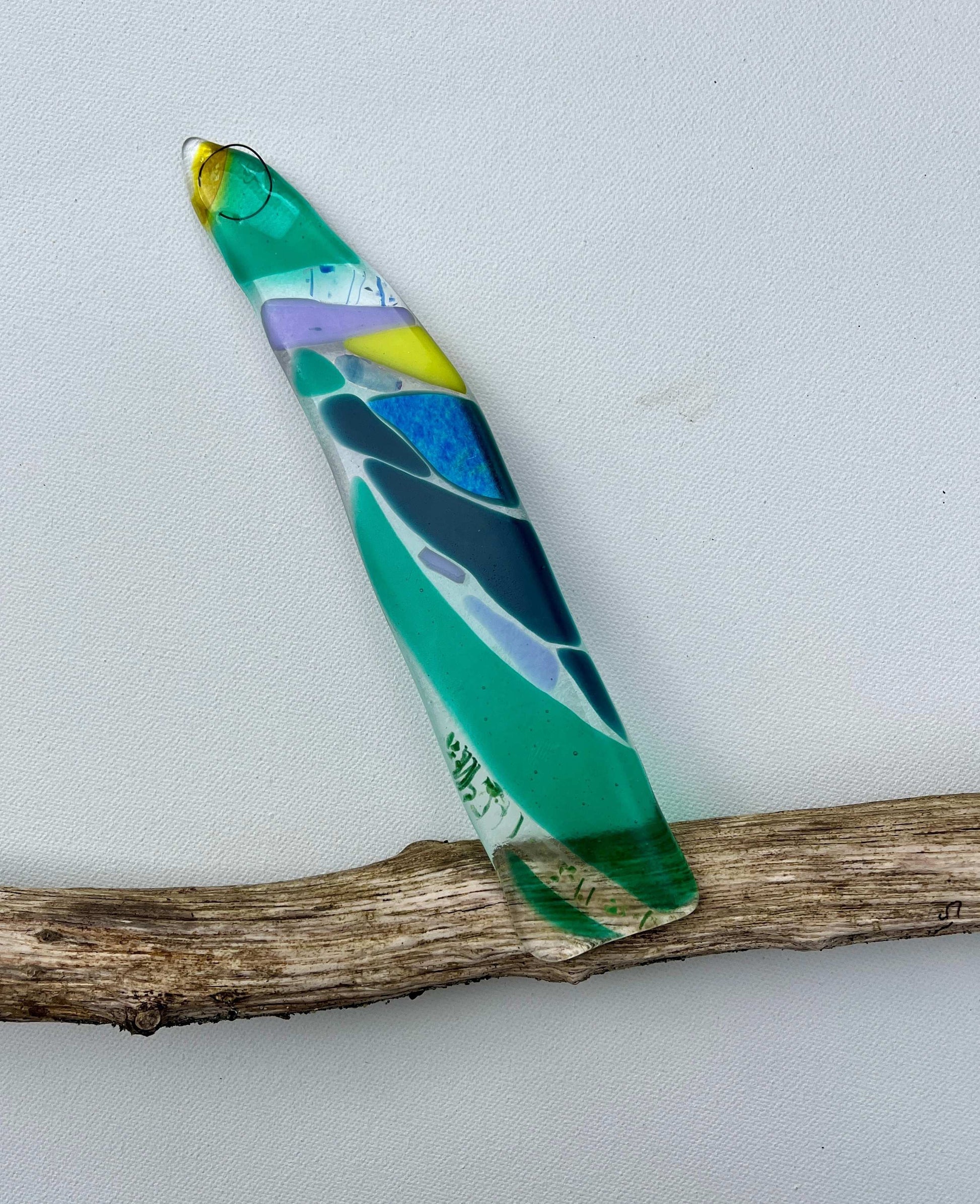 Kilned glass pendant made in greens and blues